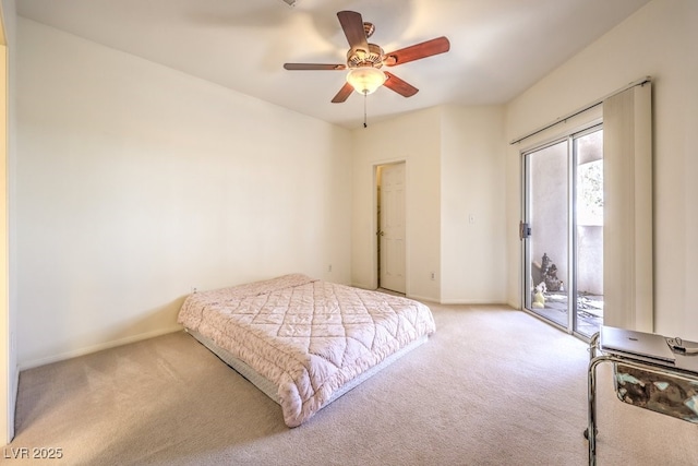 carpeted bedroom with access to outside, a ceiling fan, and baseboards