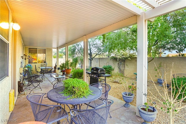 7172 Painted Paradise St, Las Vegas, NV 89131 - fenced backyard featuring outdoor dining space, a patio area, a grill, and a pergola