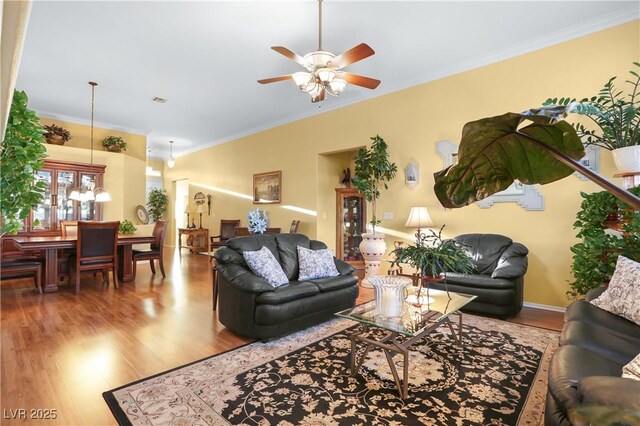 7172 Painted Paradise St, Las Vegas, NV 89131 - living room featuring crown molding, wood finished floors, and a ceiling fan
