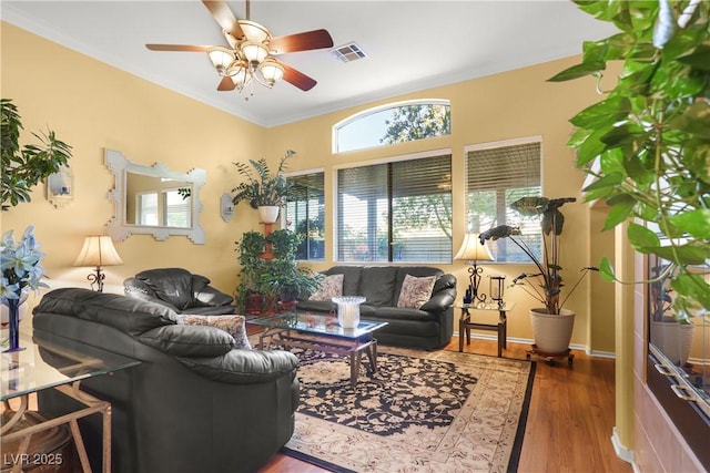 7172 Painted Paradise St, Las Vegas, NV 89131 - living area featuring a ceiling fan, wood finished floors, and crown molding