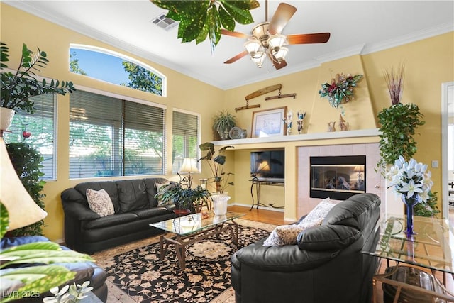 7172 Painted Paradise St, Las Vegas, NV 89131 - living room with a ceiling fan, crown molding, wood finished floors, and baseboards