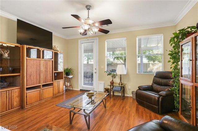 7172 Painted Paradise St, Las Vegas, NV 89131 - living room with wood finished floors, ceiling fan, ornamental molding, and baseboards