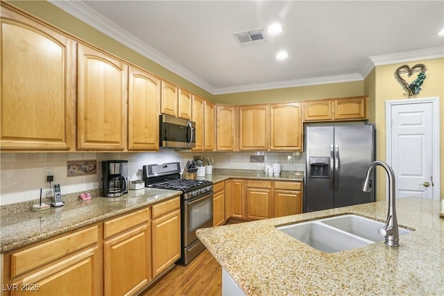 7172 Painted Paradise St, Las Vegas, NV 89131 - kitchen with stainless steel appliances, a sink, crown molding, light stone countertops, and tasteful backsplash