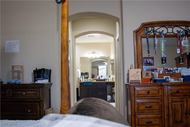 bedroom with arched walkways