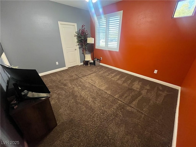 interior space featuring baseboards and carpet floors