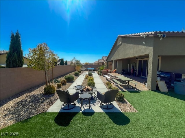 view of yard with a patio and a fenced backyard