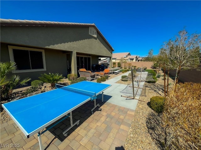 view of patio / terrace featuring fence