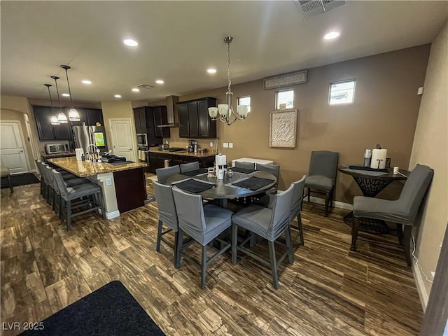 dining room with recessed lighting, a notable chandelier, dark wood-style floors, and visible vents