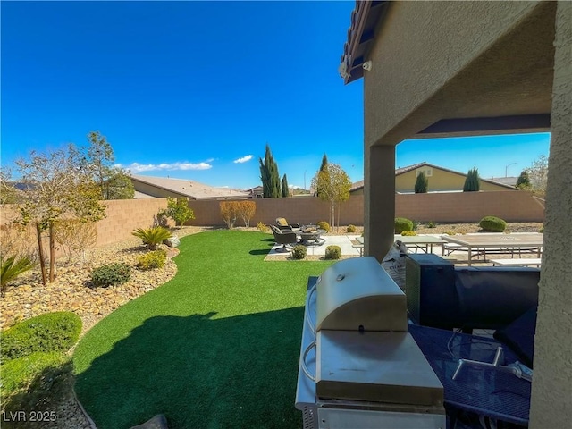 view of yard featuring a patio and a fenced backyard