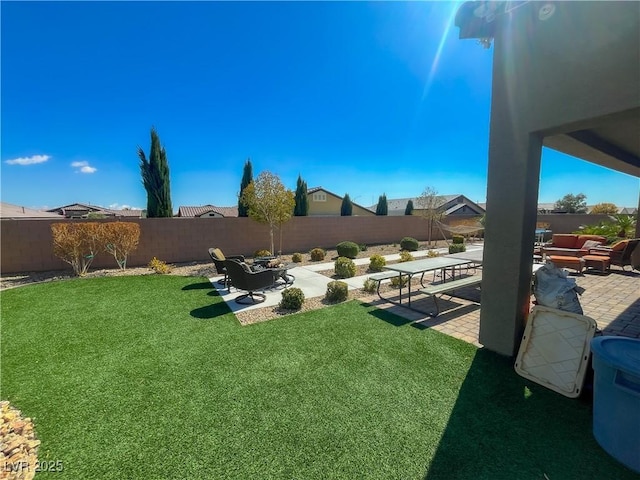 view of yard with a fenced backyard and a patio