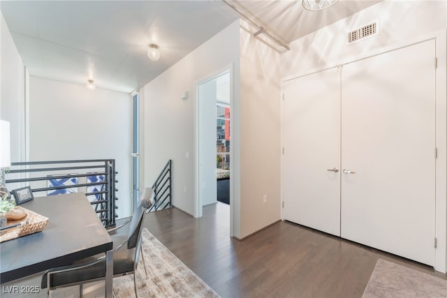 dining area with wood finished floors and visible vents