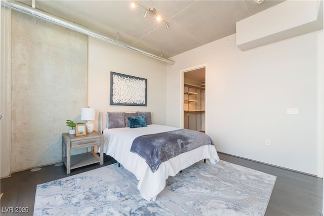 bedroom with wood finished floors