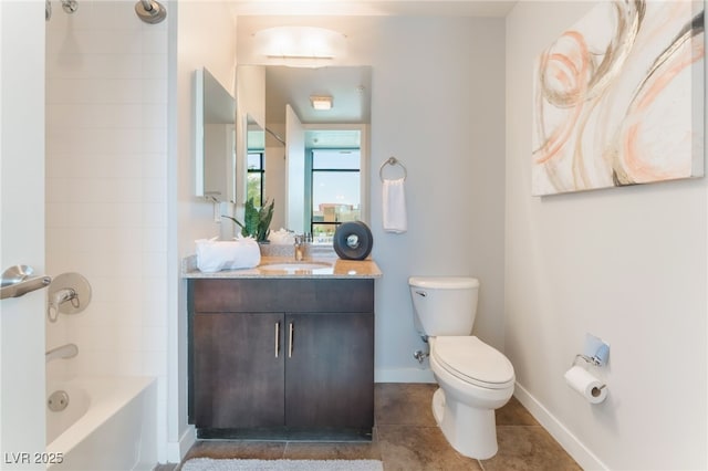 full bath featuring vanity, baseboards, bathing tub / shower combination, toilet, and tile patterned floors