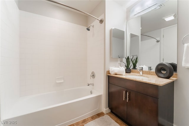 bathroom with tile patterned flooring, visible vents, tub / shower combination, and vanity