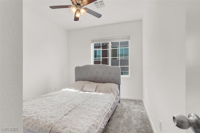 bedroom with baseboards, visible vents, carpet flooring, and a ceiling fan