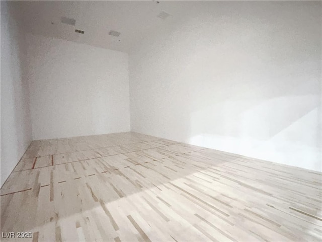 empty room featuring wood finished floors