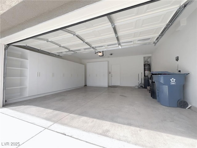 150 Short Ruff Way, Las Vegas, NV 89148 - garage featuring water heater and a garage door opener