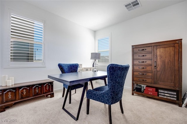 office with light carpet, baseboards, and visible vents