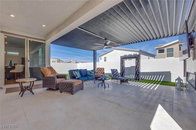view of patio / terrace with a fenced backyard, ceiling fan, and outdoor lounge area