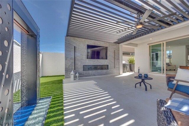 view of patio / terrace with ceiling fan and a pergola