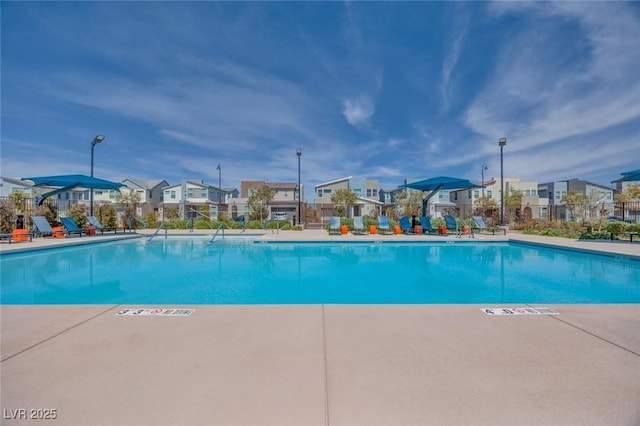 community pool with a residential view