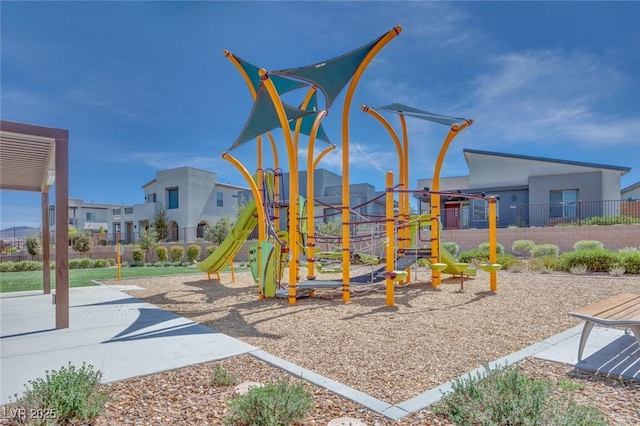 communal playground featuring fence
