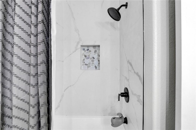 room details featuring shower / tub combo with curtain