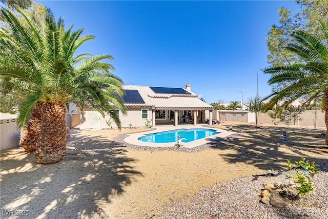 view of pool with a patio area, a fenced in pool, and fence