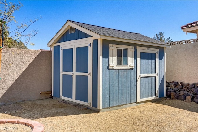 view of shed featuring a fenced backyard