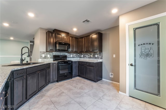 7219 Quiet Spring St, North Las Vegas, NV 89084 - kitchen with a sink, tasteful backsplash, black appliances, visible vents, and light stone counters