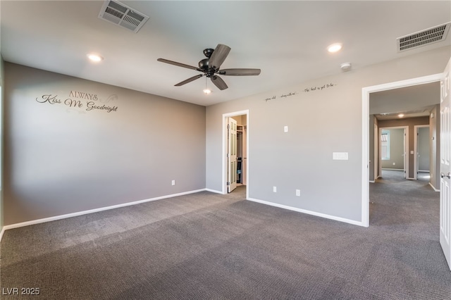 7219 Quiet Spring St, North Las Vegas, NV 89084 - spare room with visible vents, ceiling fan, dark colored carpet, and baseboards