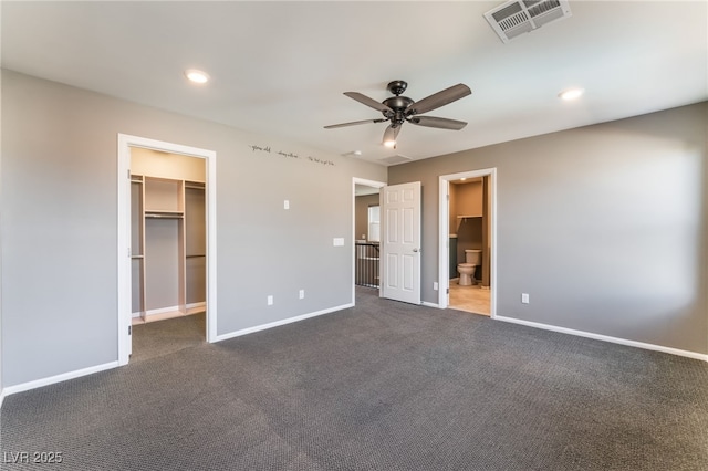 7219 Quiet Spring St, North Las Vegas, NV 89084 - unfurnished bedroom featuring recessed lighting, a walk in closet, visible vents, dark carpet, and baseboards
