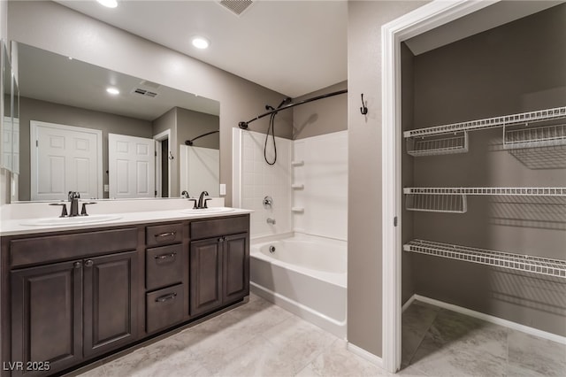 7219 Quiet Spring St, North Las Vegas, NV 89084 - full bathroom featuring visible vents, bathing tub / shower combination, double vanity, and a sink
