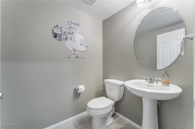 7219 Quiet Spring St, North Las Vegas, NV 89084 - bathroom with toilet, tile patterned flooring, visible vents, and baseboards
