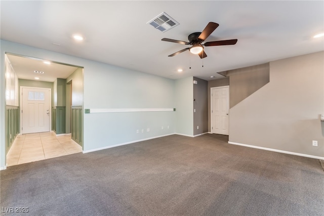 7219 Quiet Spring St, North Las Vegas, NV 89084 - tiled empty room featuring visible vents, ceiling fan, baseboards, recessed lighting, and carpet