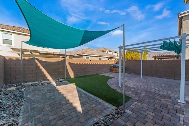 7219 Quiet Spring St, North Las Vegas, NV 89084 - view of yard featuring a patio, a fenced backyard, and a pergola