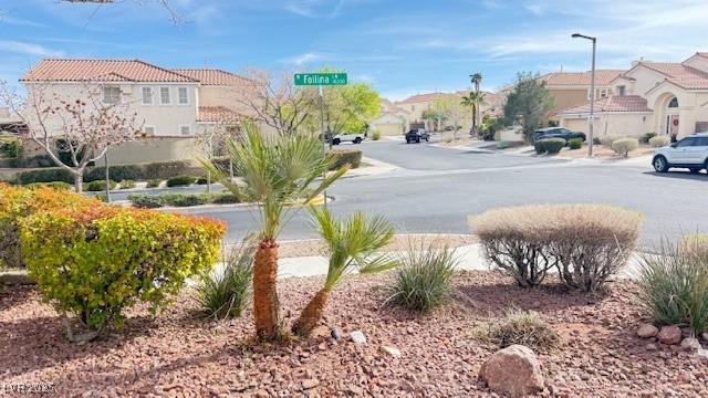 view of road featuring a residential view and street lights