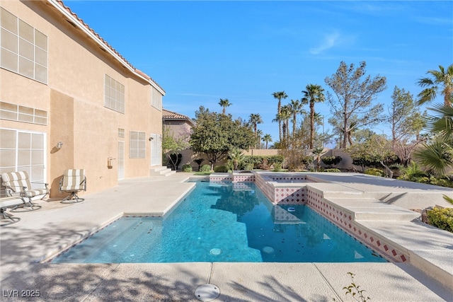 view of swimming pool with a fenced in pool, a patio, and fence private yard