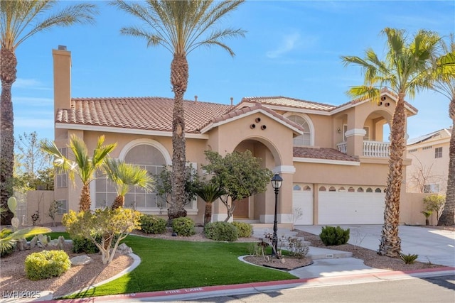 mediterranean / spanish-style house featuring a tiled roof, concrete driveway, a front yard, stucco siding, and a garage