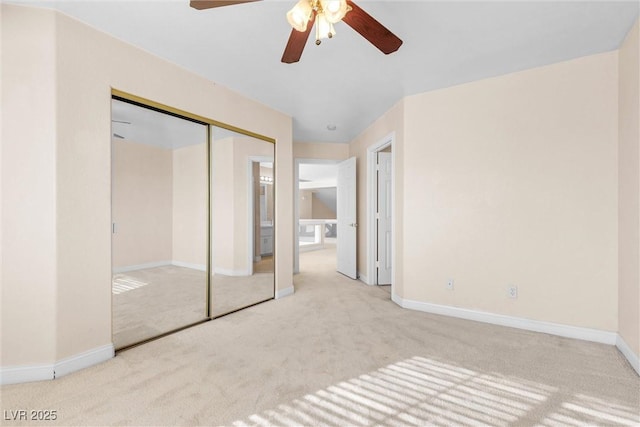 unfurnished bedroom featuring a closet, carpet flooring, and baseboards