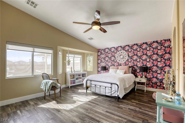 bedroom featuring wallpapered walls, visible vents, baseboards, and vaulted ceiling