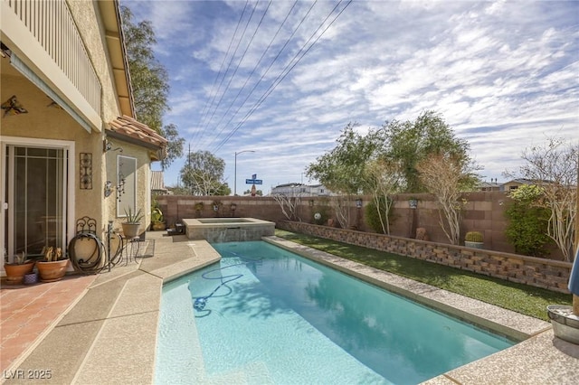 view of pool featuring a pool with connected hot tub, a fenced backyard, and a patio area