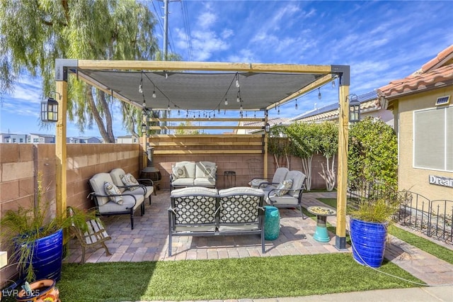 view of patio with outdoor lounge area and a fenced backyard