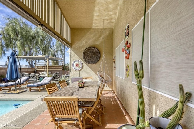 view of patio / terrace featuring an outdoor pool, outdoor lounge area, outdoor dining area, and fence