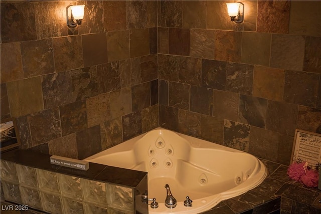 full bathroom with a whirlpool tub