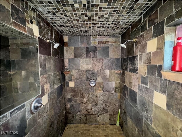 bathroom with a tile shower