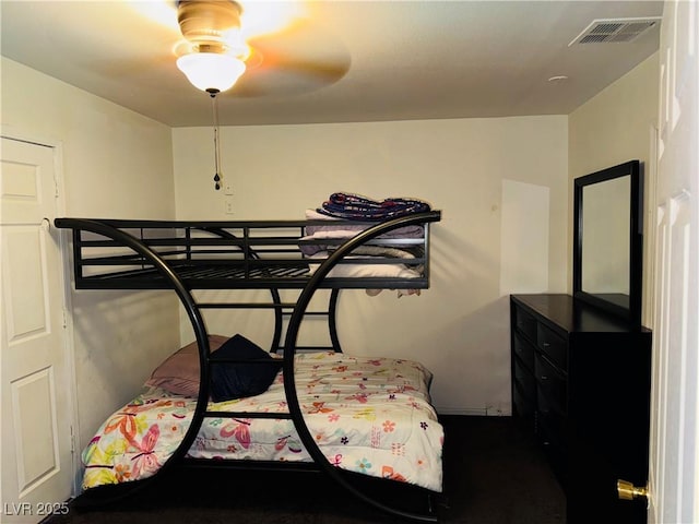 bedroom featuring visible vents and ceiling fan