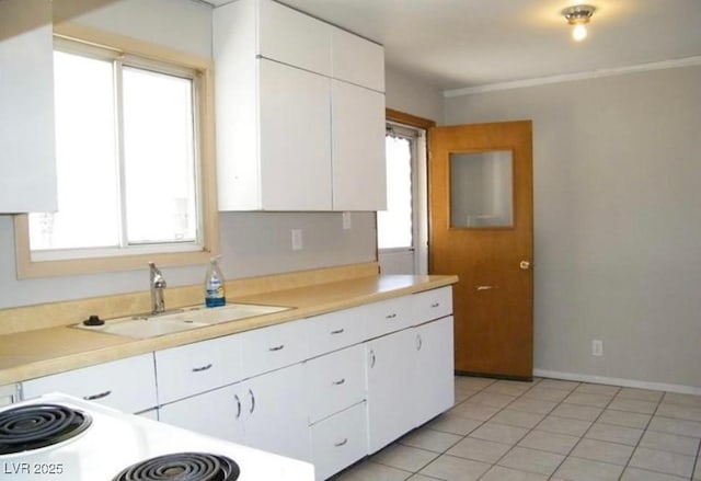 1016 Park Ave, Ely, NV 89301 - kitchen featuring white cabinetry, a sink, and a healthy amount of sunlight
