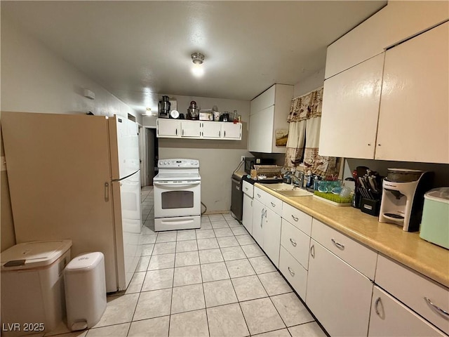 1016 Park Ave, Ely, NV 89301 - kitchen featuring white cabinetry, light countertops, white appliances, light tile patterned floors, and a sink