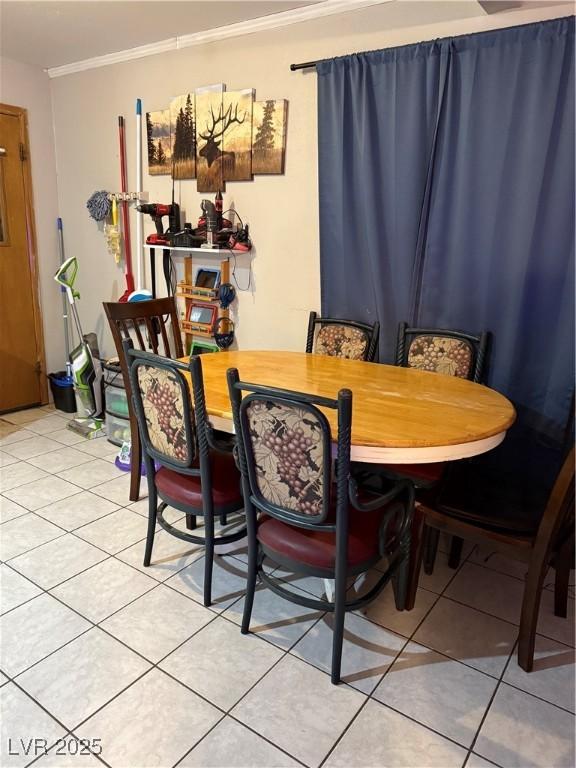 1016 Park Ave, Ely, NV 89301 - dining space with light tile patterned flooring and ornamental molding